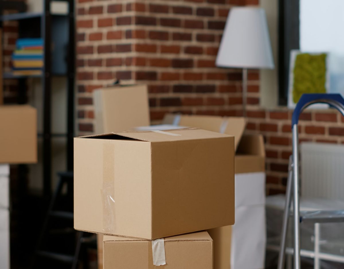Stacks,Of,Cardboard,Boxes,In,Empty,Real,Estate,Property,With